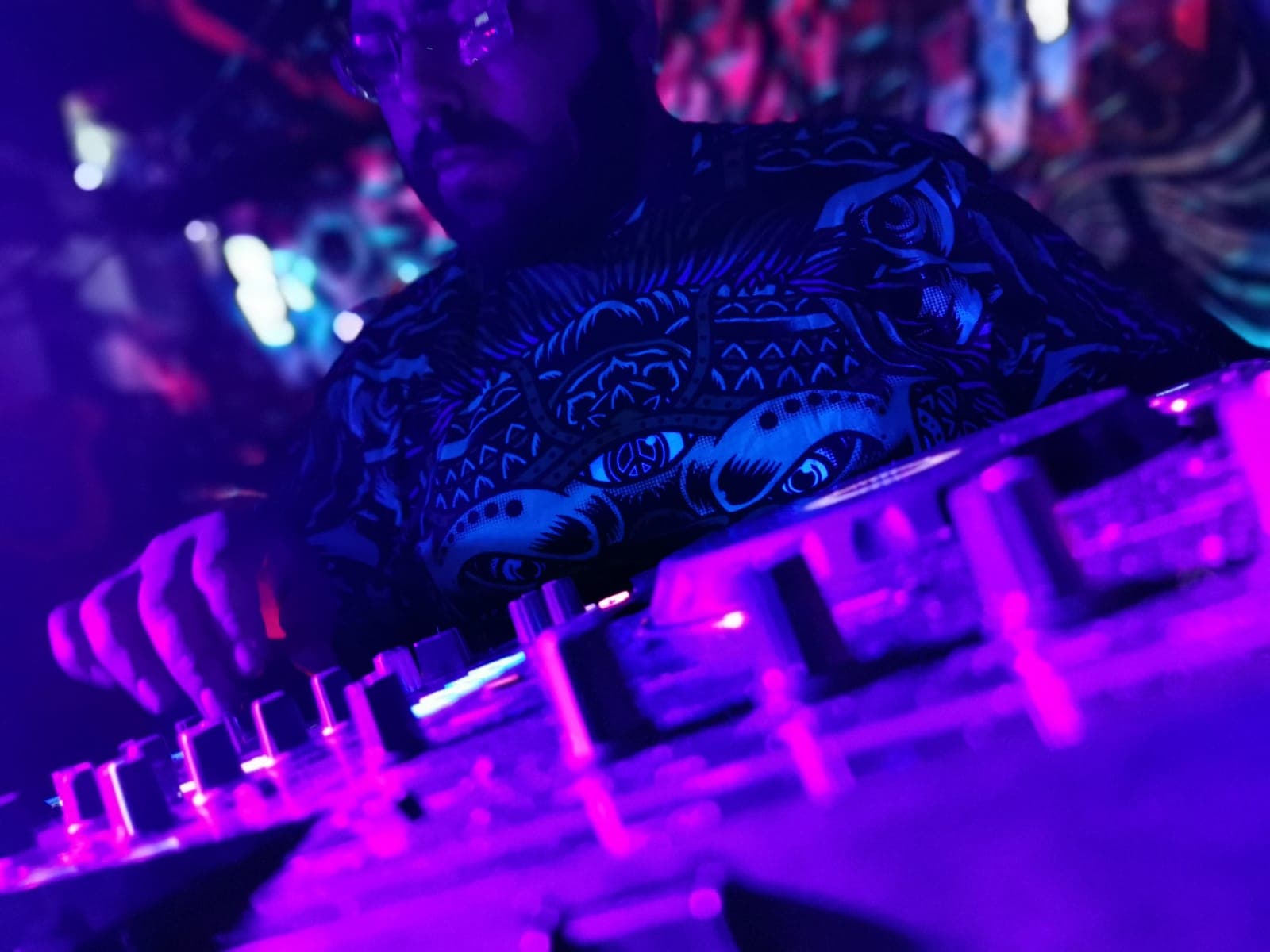 Stack Rack live DJ set — close-up of decks under purple UV lights