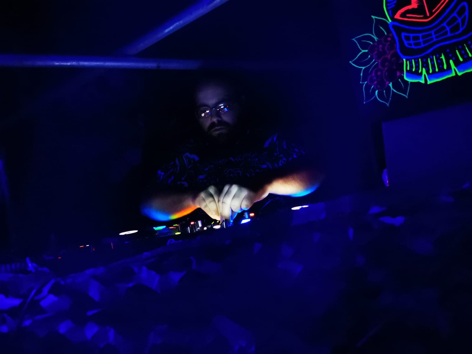 Stack Rack performing live under blue UV lights